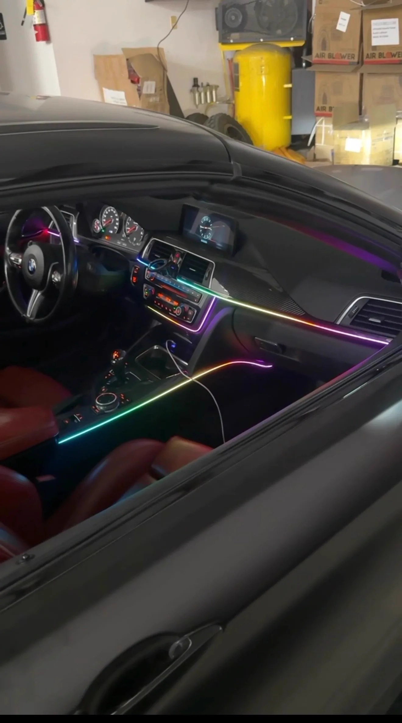 BMW interior with multicolour fiber optic ambient lighting through the dash, console and doors
