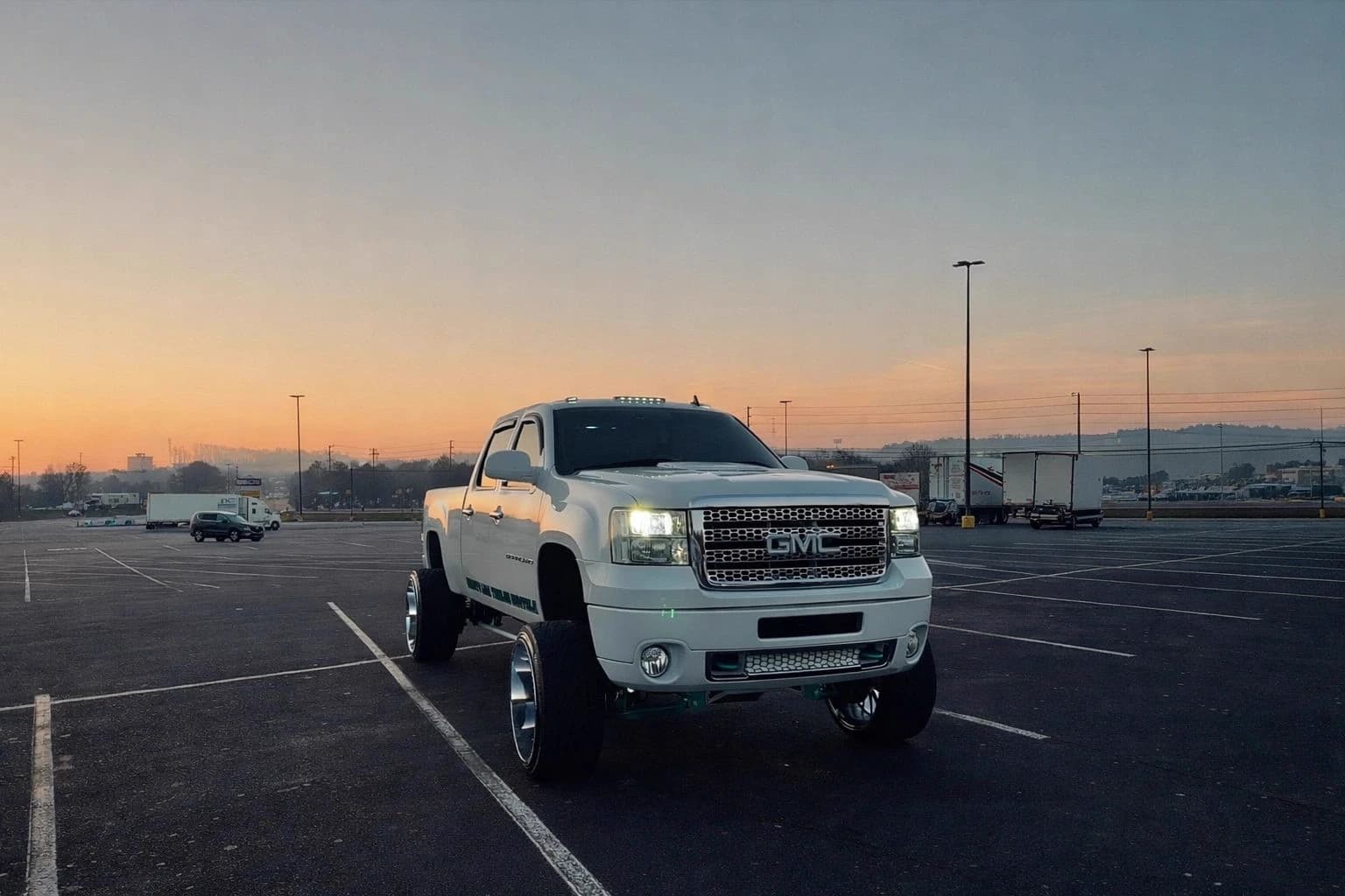 White GMC Denali HD on forged wheels at sunset, a complete Forge Customz build
